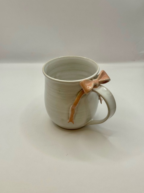 Uroczy kubek ceramiczny z jasnoróżową kokardką ok 250ml