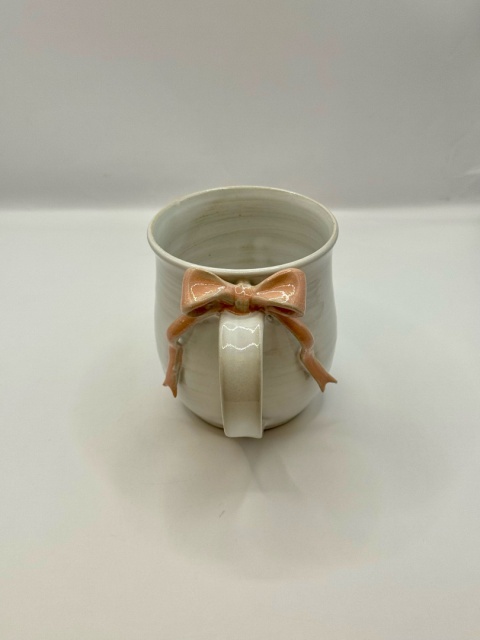 Uroczy kubek ceramiczny z jasnoróżową kokardką ok 250ml